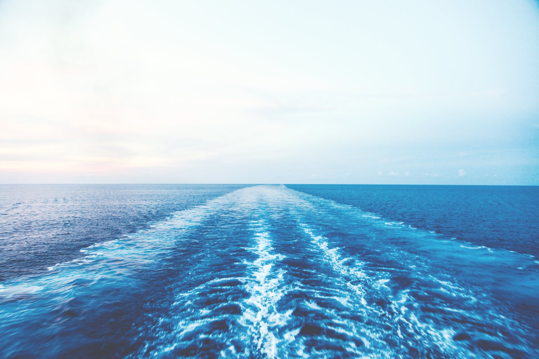 blue body of water under clear blue sky