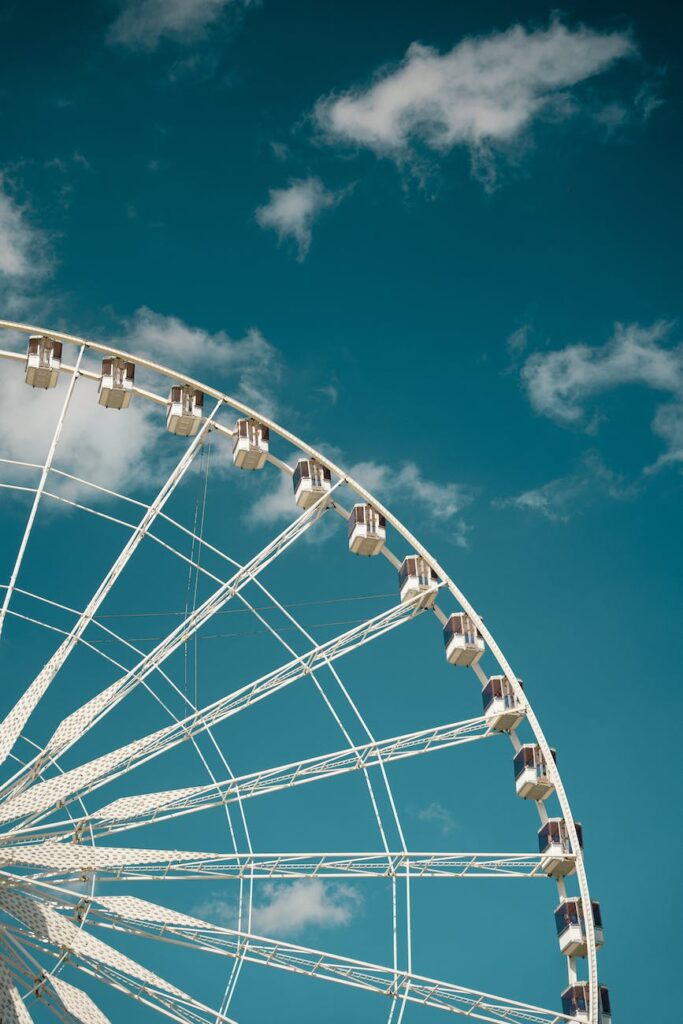 white ferris wheel under blue sky