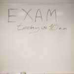 an announcement written on a whiteboard