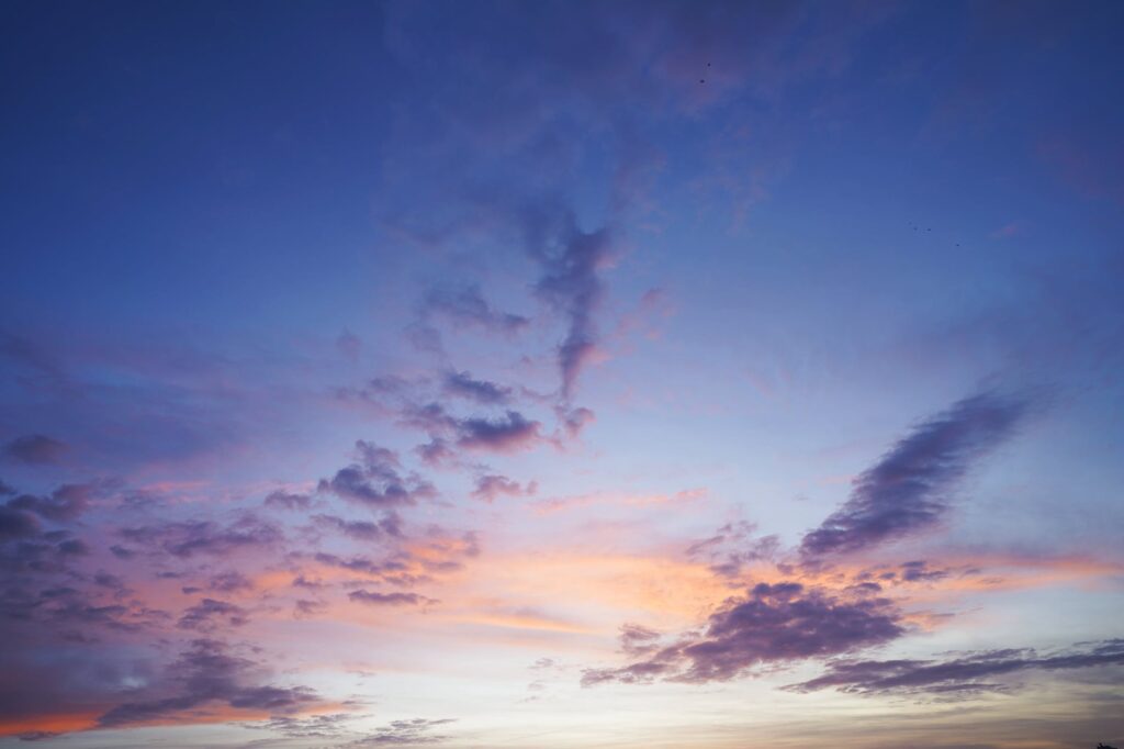 gray clouds and blue sky at sunset
