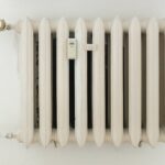 white steel rib radiator in a new bright renovated room in apartment or home