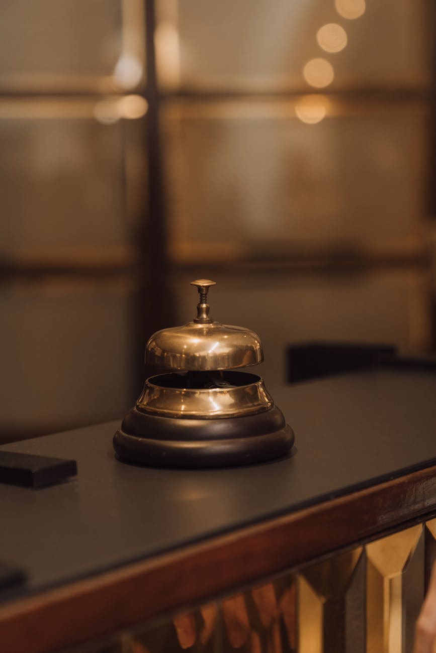 close up of gold bell on desk