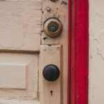 aged yellow door with red cant