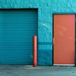 brown panel door near roll up gate