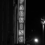 grayscale photo of parking signage