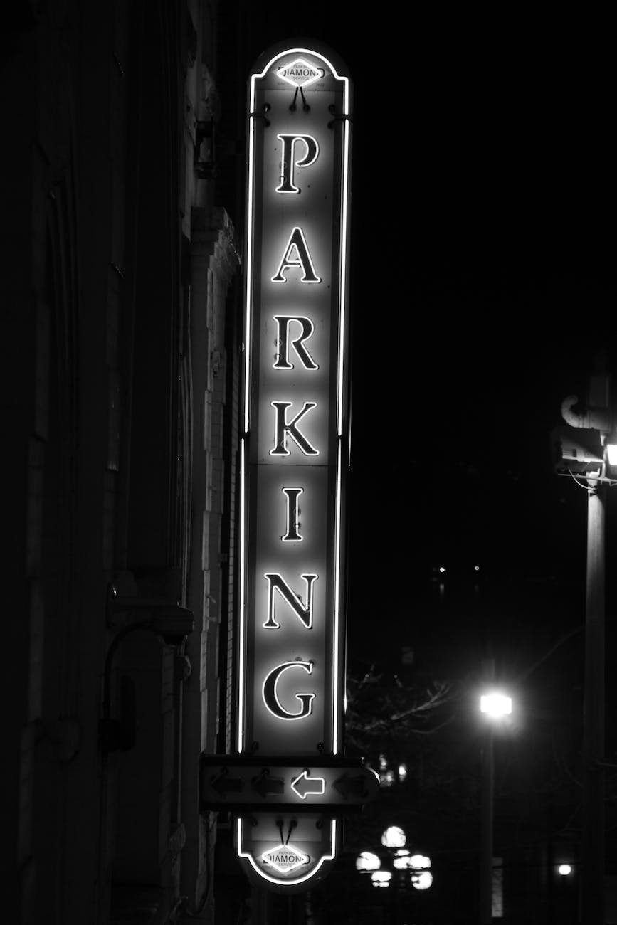 grayscale photo of parking signage