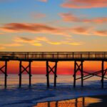 beach bridge clouds dawn