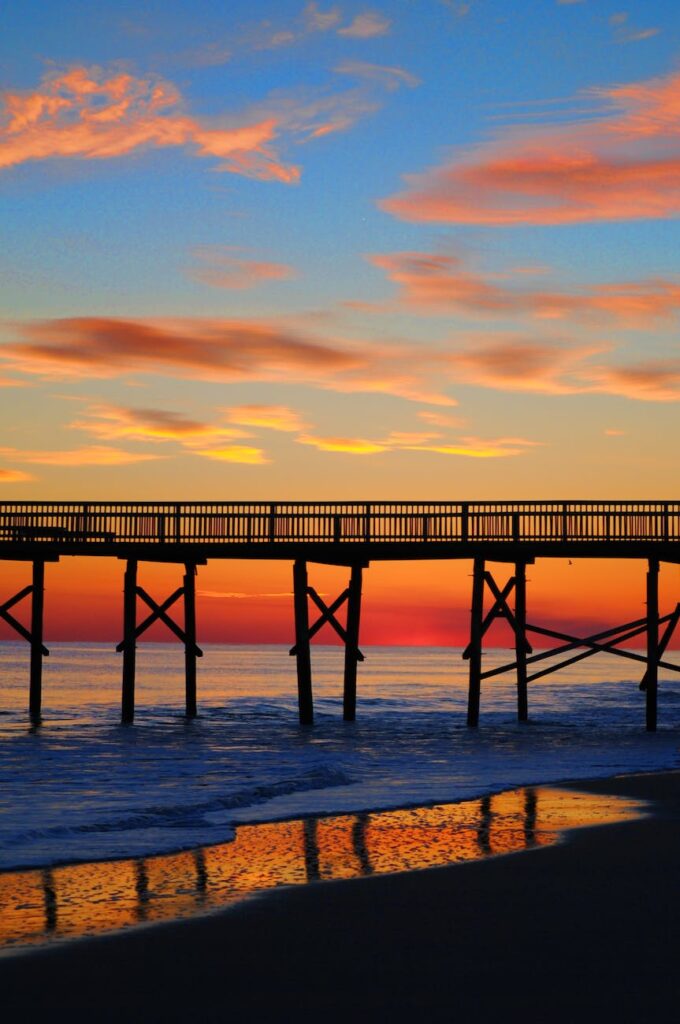 beach bridge clouds dawn