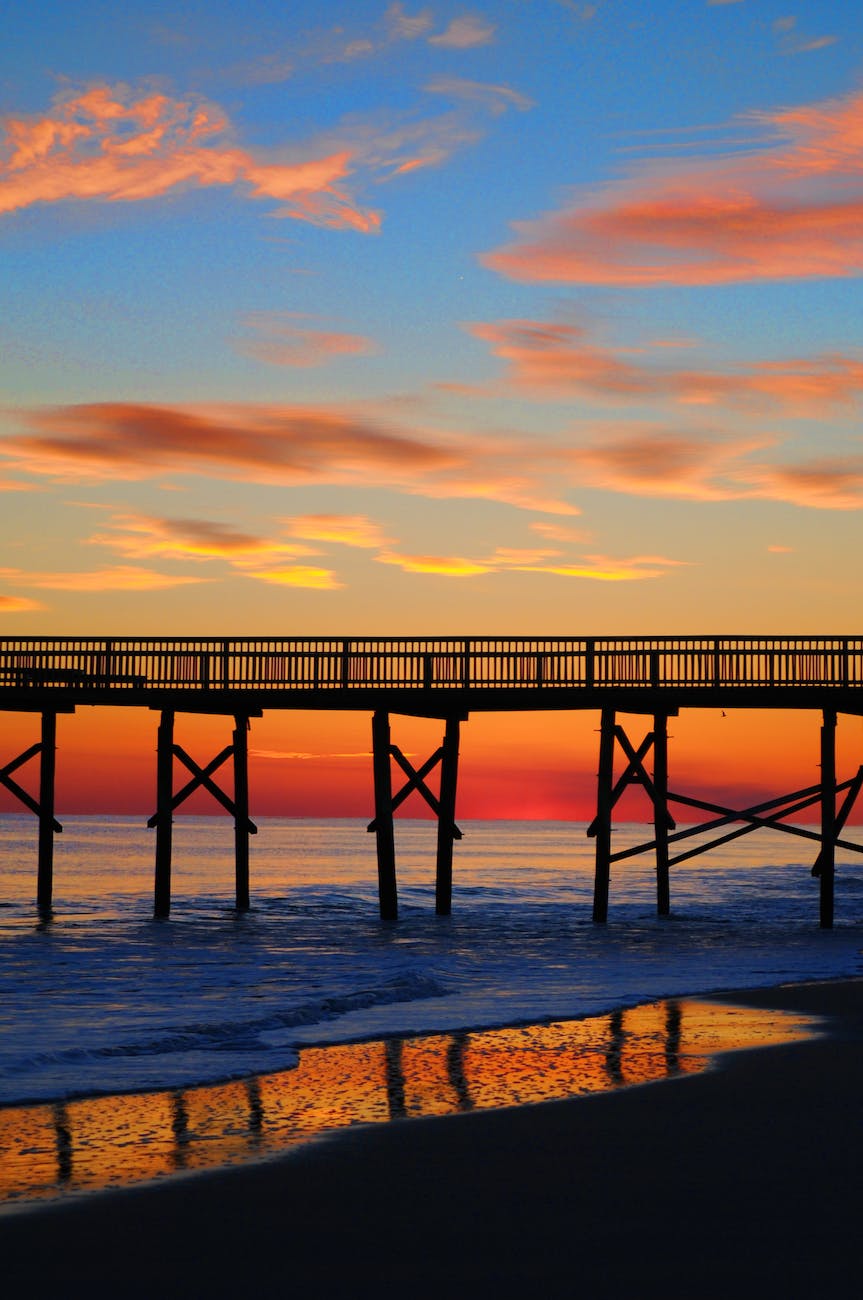 beach bridge clouds dawn