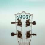 shallow focus photo of guitar head stock