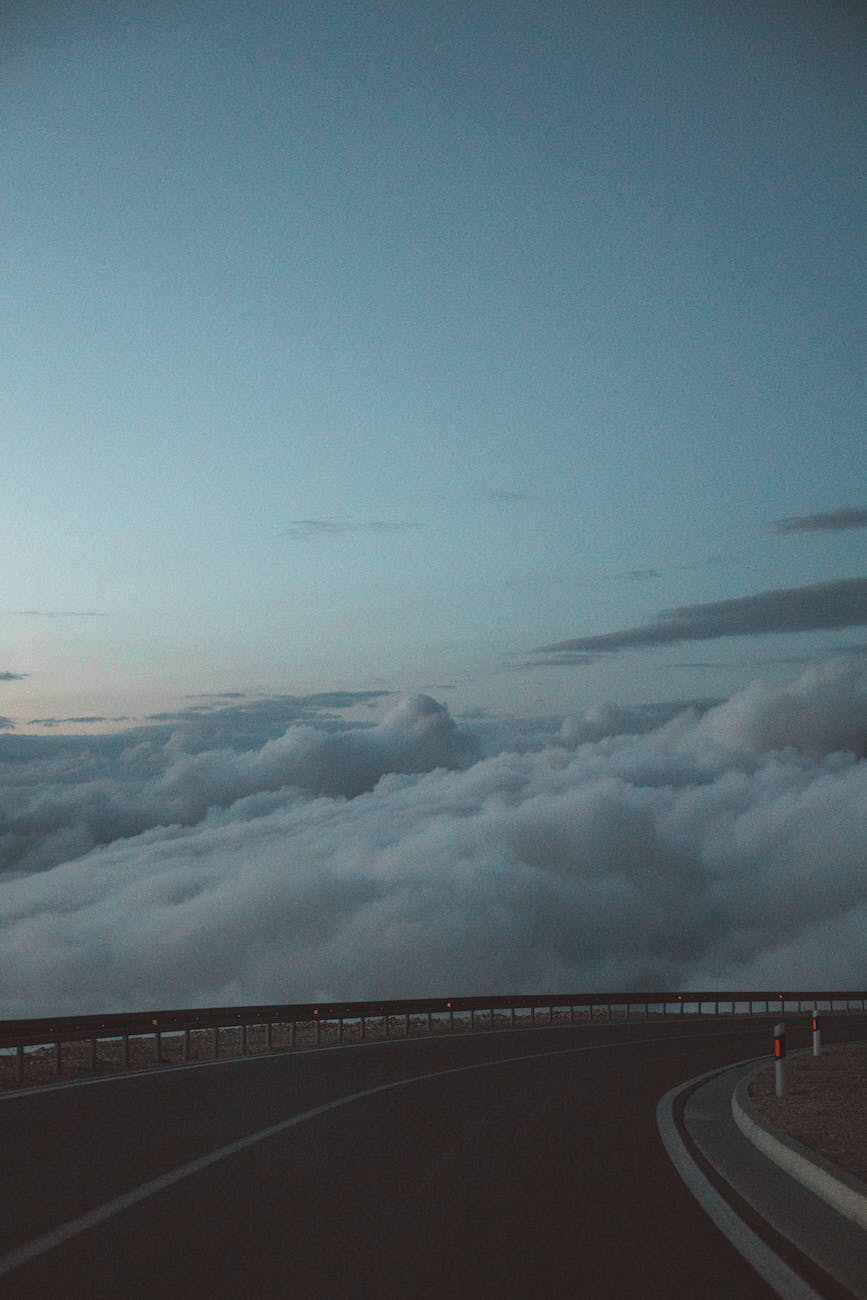 white clouds near roadway