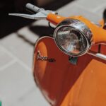 orange motorcycle on gray concrete road