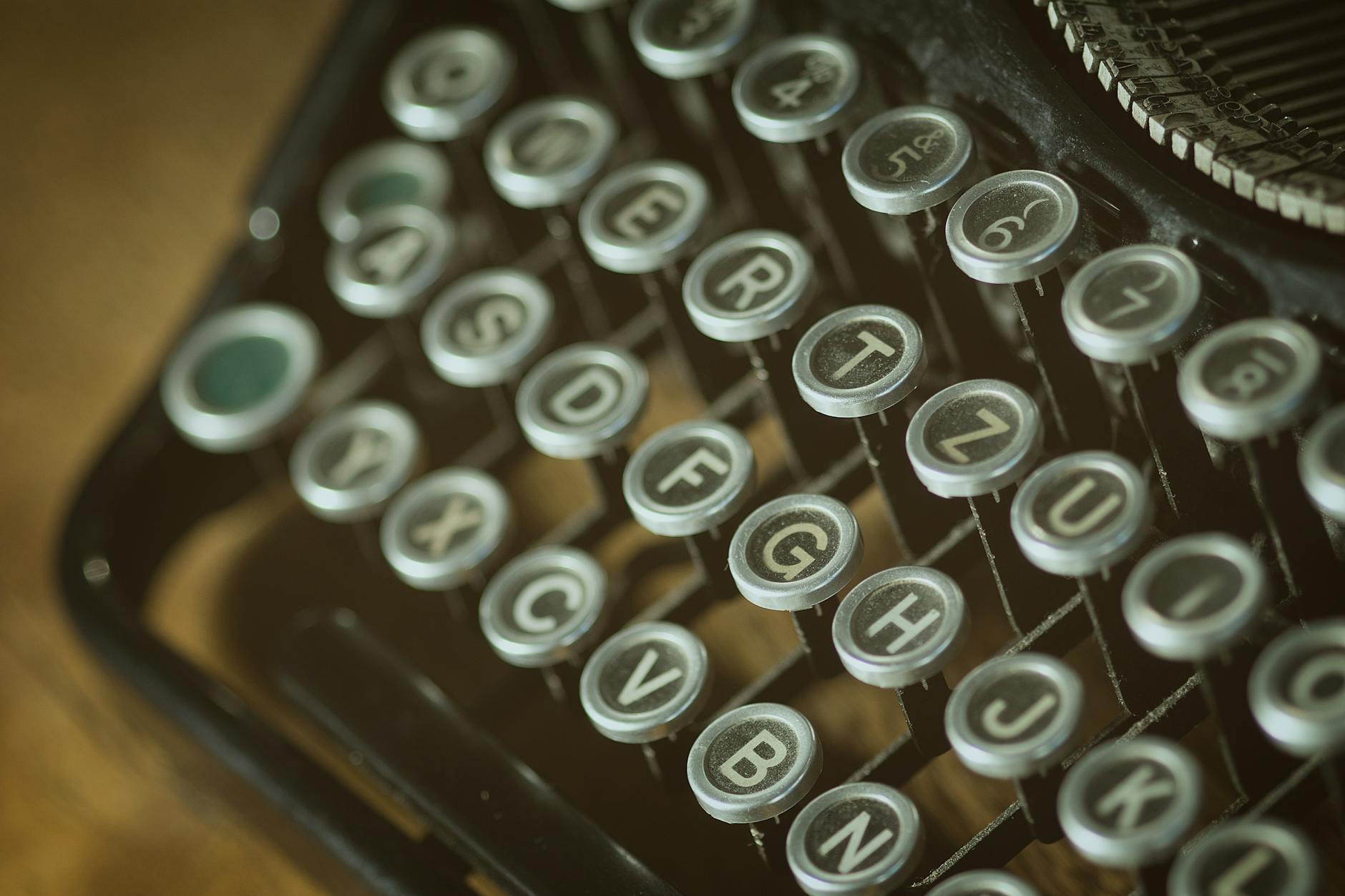 shallow photoghrapy of black and gray type writer keys