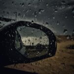 car window panel with water droplets