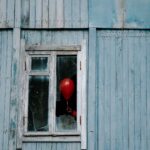 balloon on a shattered window