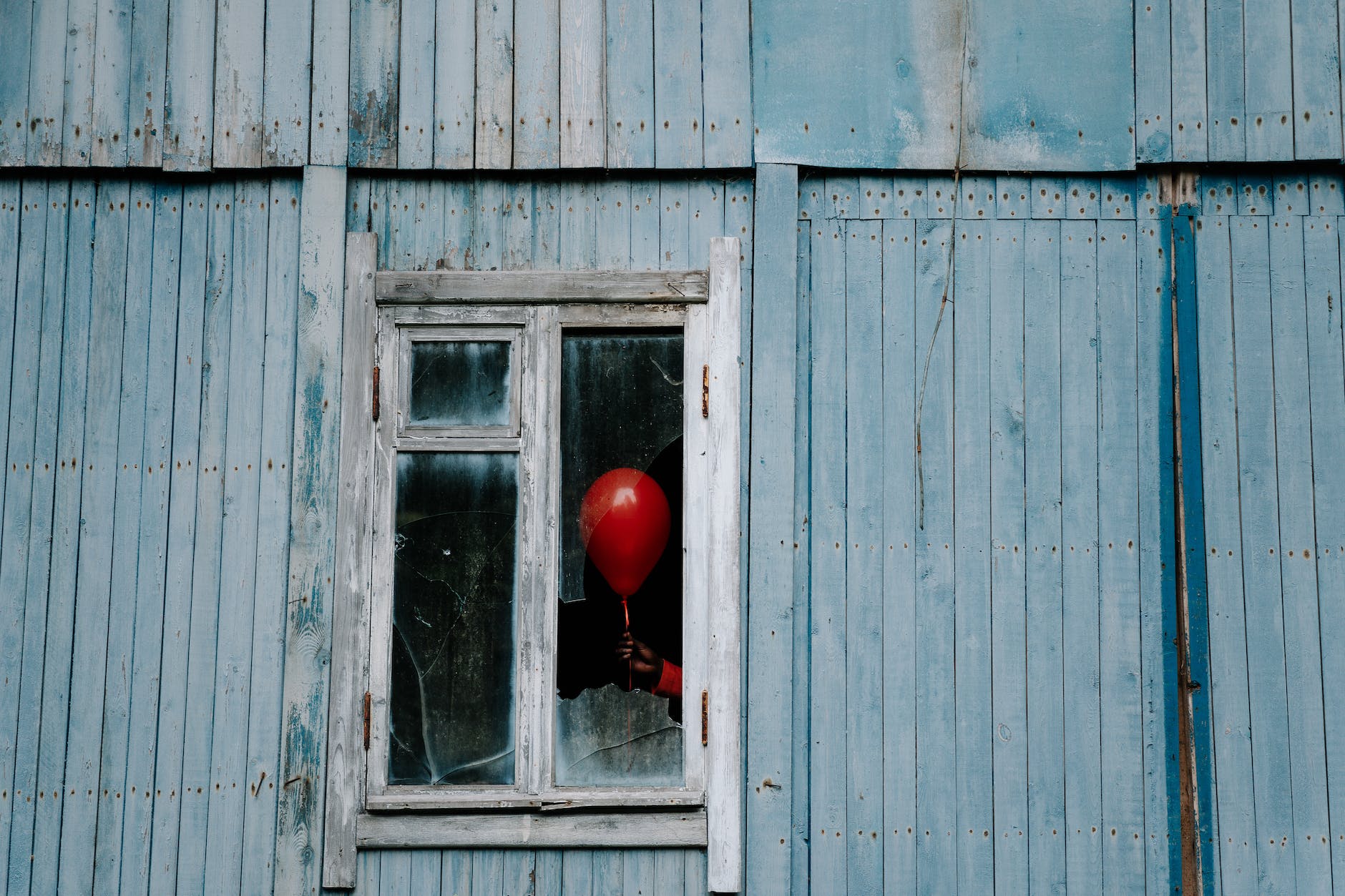 balloon on a shattered window
