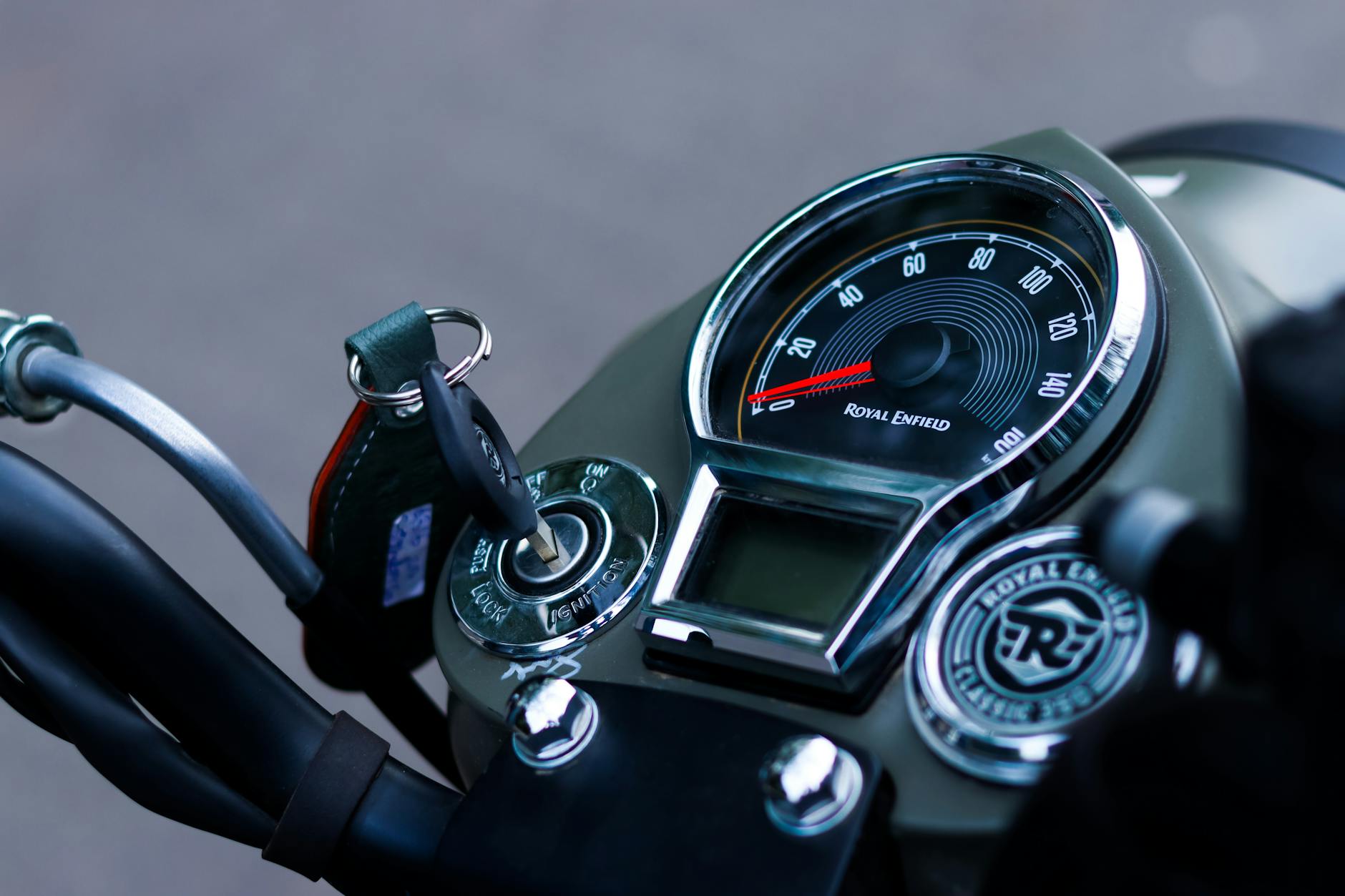 close up of the speedometer of a royal enfield motorcycle