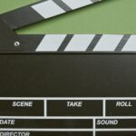 clapper board in green surface